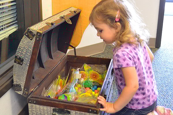 little girl getting a prize
