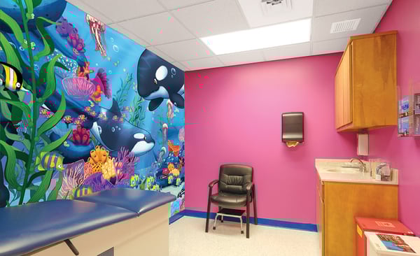 medical clinic exam room with ocean mural