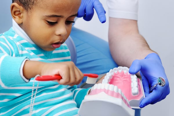 little-boy-with-dental-model